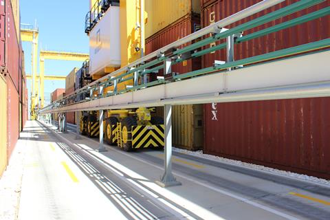 The E-RTG engaged with the conductor rail, working in one block.